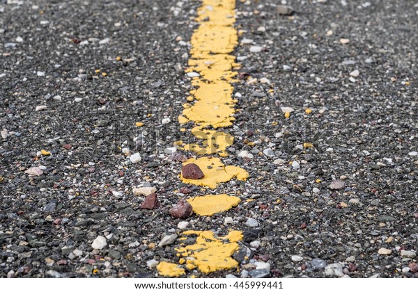 asphalt road with marking lines and tire tracks.
crack surface