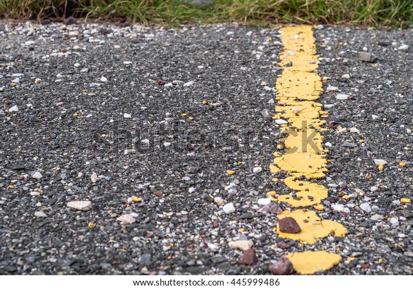 asphalt road with marking lines and tire tracks.\
crack surface