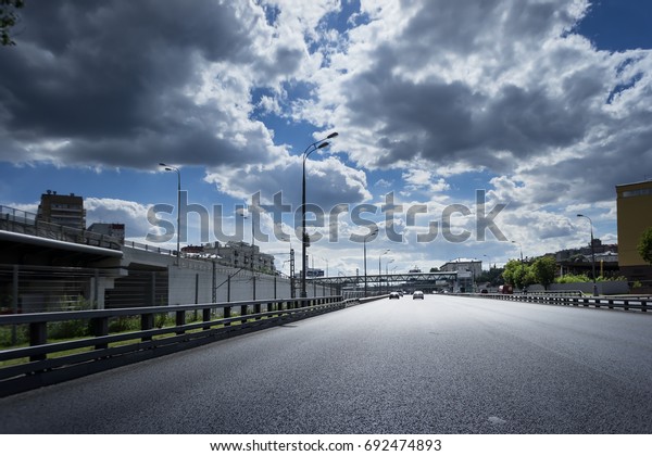 asphalt road with\
metal bump and road\
juction.