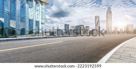 Asphalt road and modern city skyline with buildings in Ningbo, Zhejiang Province, China. East new town of Ningbo, It is the economic, cultural and commercial center of Ningbo City.