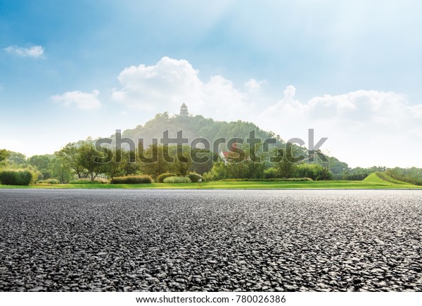asphalt\
road and mountain nature landscape in city\
park