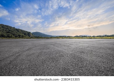 Asphalt road and mountain with sky clouds background - Powered by Shutterstock