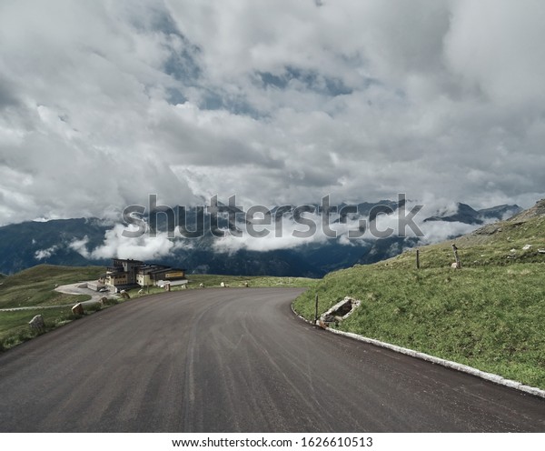 Asphalt\
road in mounts. Road to the mountains. Alpen\
road