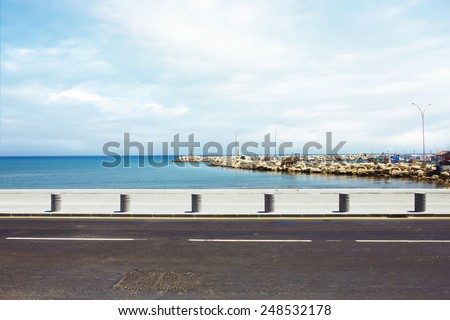 Asphalt road near the port and sea promenade 
