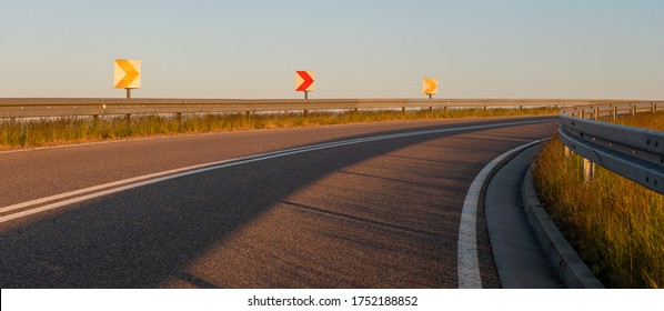 Asphalt Road On The Bypass Highway In The Light Of The Setting Sun