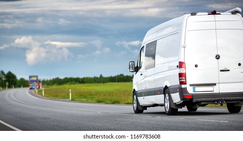 Asphalt Road On With A Small Truck. Van Moving