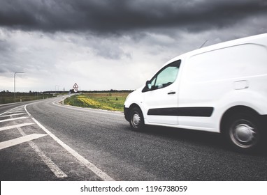 Asphalt Road On With A Small Truck. Van Moving