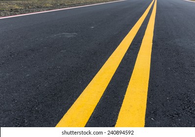 Asphalt Road With Pair Of Yellow Line