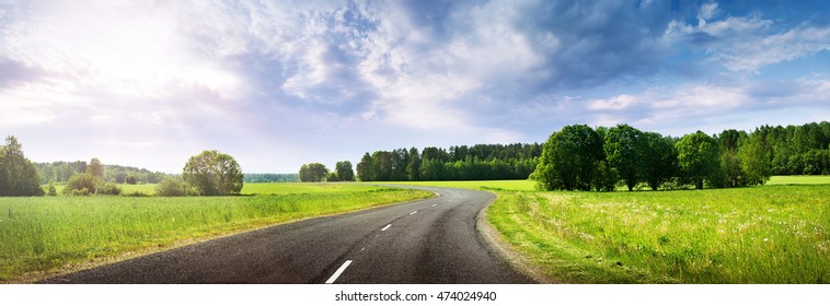 asphalt road panorama in countryside on beautiful evening