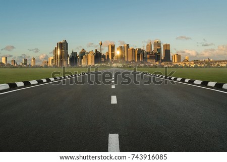 asphalt road in perspective view with urban cityscape in daytime, empty highway with skyline city skyscraper in Sydney