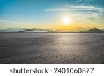 Asphalt road platform and beautiful coastline with mountain natural landscape at sunset. High Angle view.