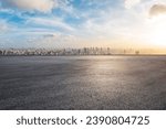 Asphalt road platform and city skyline with skyscraper at sunset in Shanghai, China. High Angle view.