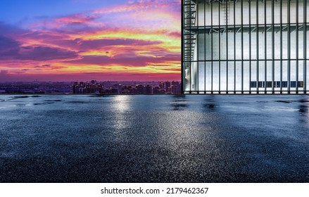 Asphalt Road Platform And City Skyline With Sky Cloud Scenery At Sunset