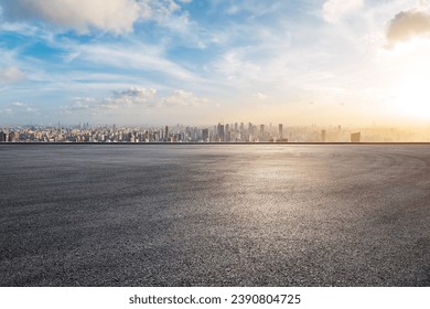 Asphalt road platform and city skyline with skyscraper at sunset in Shanghai, China. High Angle view. - Powered by Shutterstock