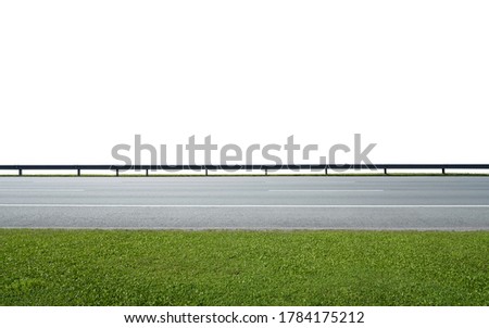 Asphalt road with railings and green grass，isolated on white background with clipping path. Side angle view