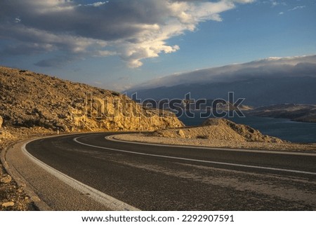An asphalt road running past a beautiful viewpoint on the Island of Pag,Croatia.