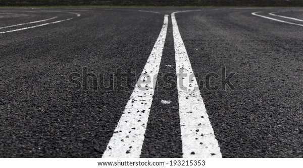 Asphalt road with separation\
lines