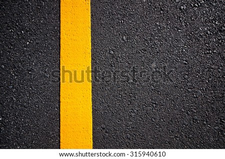 Asphalt road with separation yellow lines