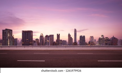 Asphalt Road Side With Beautiful Bangkok City Skyline. Night Scene