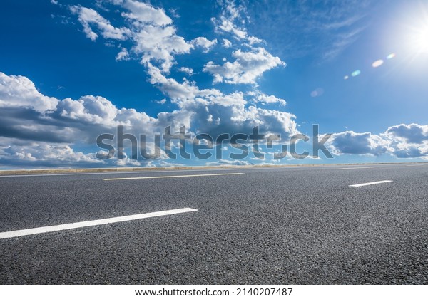 Asphalt road and sky cloud under blue sky.\
Road and sky\
background.