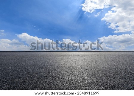 Asphalt road and sky clouds background
