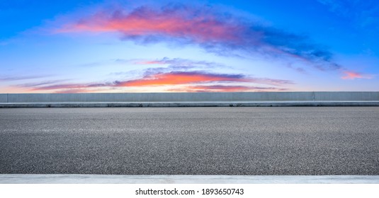 Asphalt road and sky clouds at sunset.Road background.