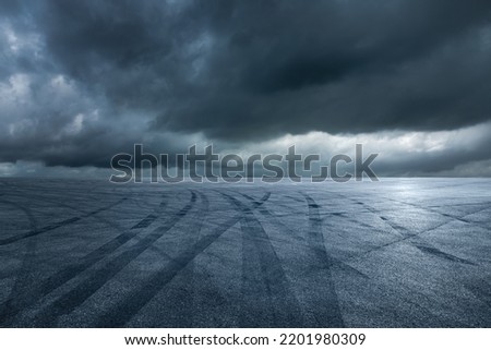 Asphalt road and sky dark cloud background