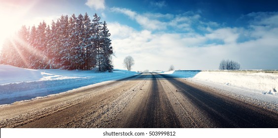 Asphalt Road In Snowy Winter On Beautiful Frosty Sunny Day