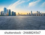 Asphalt road square and city skyline with modern buildings scenery at sunrise in Chongqing