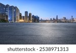 Asphalt road square and city skyline with modern buildings scenery at night in Chongqing. car advertising background.