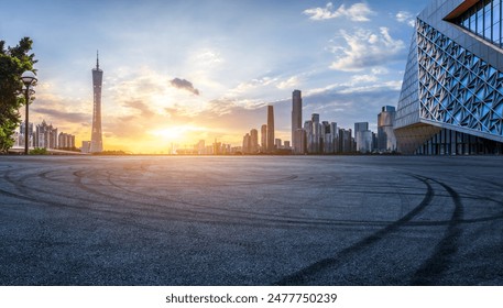 Asphalt road square and city skyline with modern buildings scenery at sunset in Guangzhou. Panoramic view. - Powered by Shutterstock