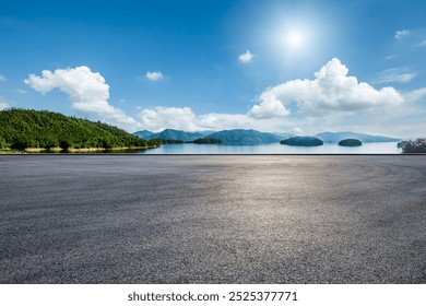 Asphalt road square and clear lake with green mountain nature landscape under blue sky. Car background. - Powered by Shutterstock