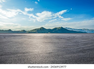 Asphalt road square and green mountain with sky clouds natural landscape at sunrise - Powered by Shutterstock