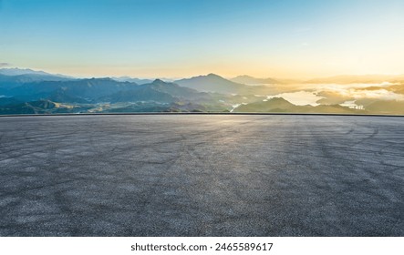 Asphalt road square and green mountain nature landscape at sunrise - Powered by Shutterstock