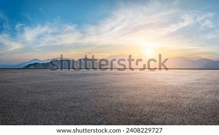 Asphalt road square and green mountain with sky clouds at sunset. High Angle view.