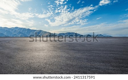 Asphalt road square and green mountain natural landscape at sunset