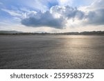 Asphalt road square and sky clouds nature background. Outdoor asphalt parking lot.