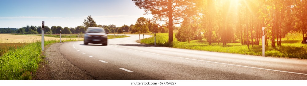 asphalt road view in countryside at beautiful sunset