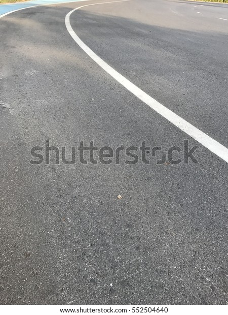 asphalt road, white\
line, symbol on road,