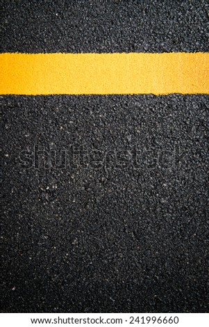 Asphalt road, yellow line on the new road