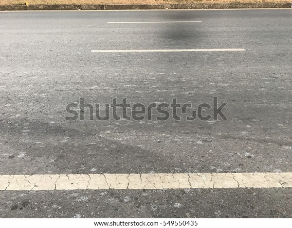 asphalt road,\
yellow line,  symbol on road,\
week