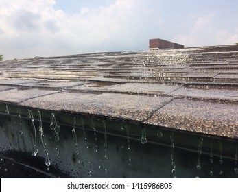 Asphalt Roof House. Side View When It Rains
