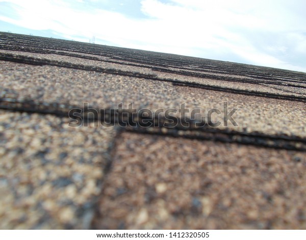 Asphalt roof house. Side\
view