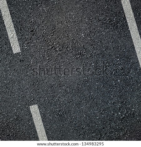 Asphalt surface of road with white lines