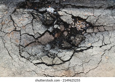 Asphalt Swelling Close-up. Pothole And Pit On Road