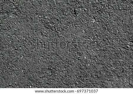 Similar – Image, Stock Photo Asphalt surface of a street with paved sidewalk backlit with the shadow of a street sign