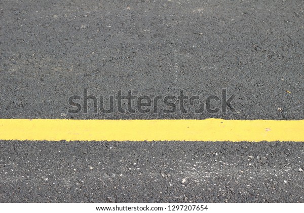Asphalt texture\
with road markings\
background