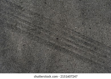 Asphalt Texture With White Line And Tire Marks. Smooth Asphalt Road. Tarmac Dark Grey Grainy Road Background.Top View