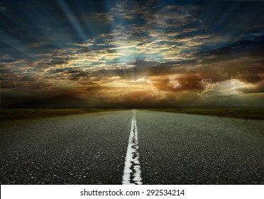 Asphalted road on the background of storm clouds - Powered by Shutterstock