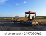 Asphalting paving repairing works. Vibrator compactor machine on roadworks on city street. Asphalt road roller on road construction. Road Construction Equipment. Vibration roller on Asphalting.